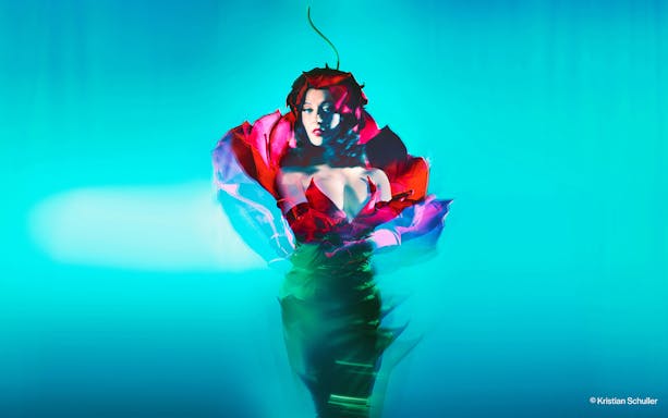 Performer in vibrant costume at BLINDED by DELIGHT Grand Show, Friedrichstadt Palast, Berlin.