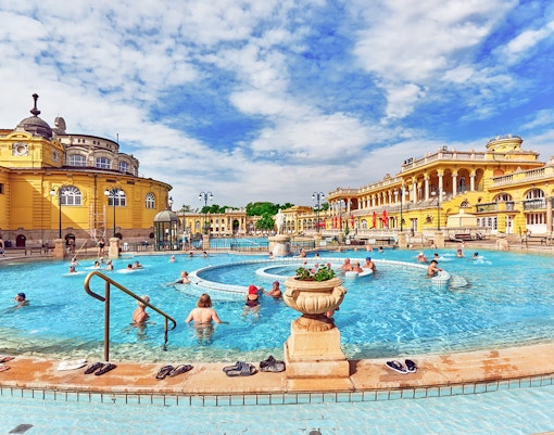 Courtyard view of Szechenyi Baths, Budapest, featuring thermal pools and historic architecture.