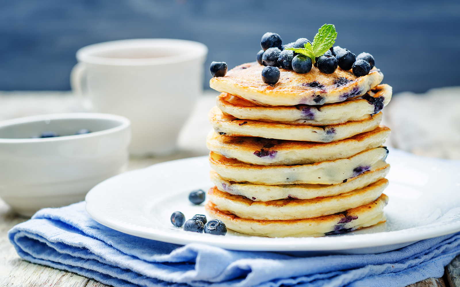 Blueberry Ricotta Pancakes stacked on top of each other