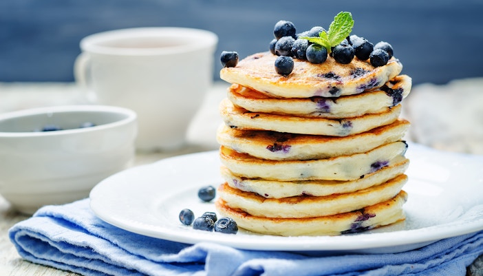 Blueberry Ricotta Pancakes stacked on top of each other