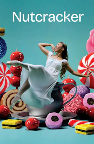 Ballerina dancing among oversized sweets, promoting Nutcracker West End show.