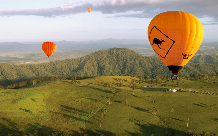 Hot air balloons over Gold Coast landscape, Australia.