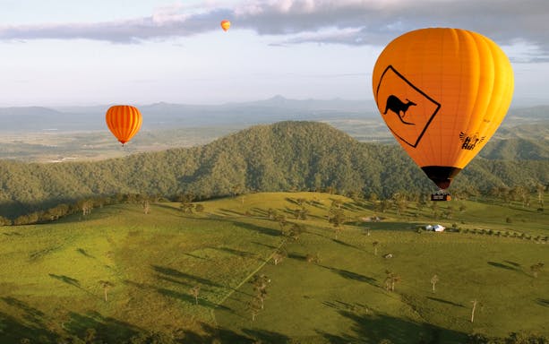 Hot air balloons over Gold Coast landscape, Australia.