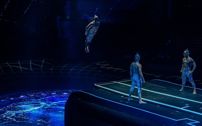 Acrobats performing a high dive at La Perle show in Dubai.