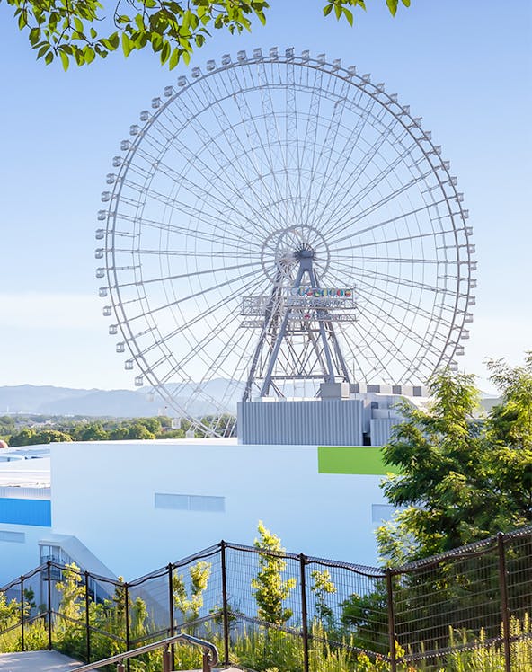 Ferris wheel at Redhorse Osaka with clear blue sky.