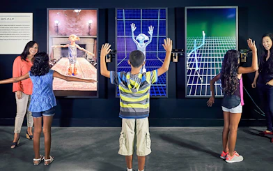 Visitors engaging with motion capture exhibits at Warner Bros Studio Tour Hollywood.