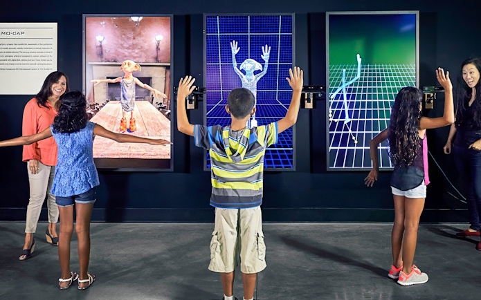 Visitors engaging with motion capture exhibits at Warner Bros Studio Tour Hollywood.