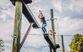 Ziplining adventure at Mega Adventure Park, Singapore with participants on the course.