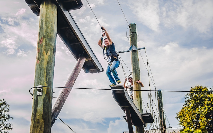 Ziplining adventure at Mega Adventure Park, Singapore with participants on the course.