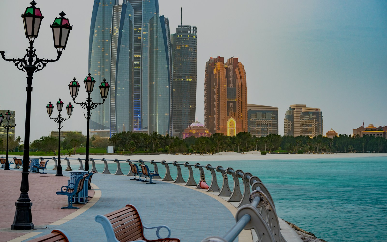 Corniche Abu Dhabi promenade with city skyline and waterfront.
