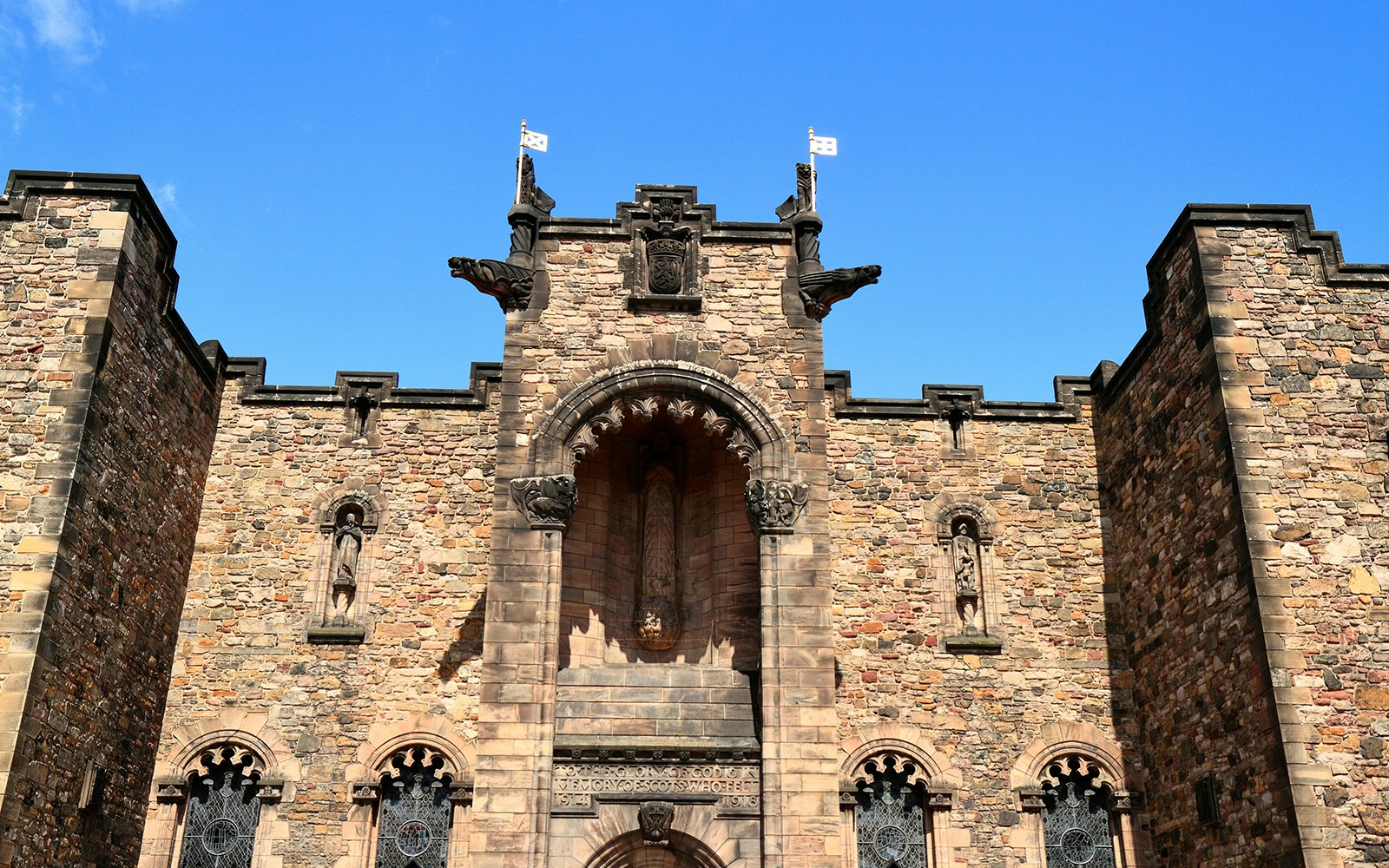 Edinburgh Castle Scottish National War Memorial stone facade with statues.