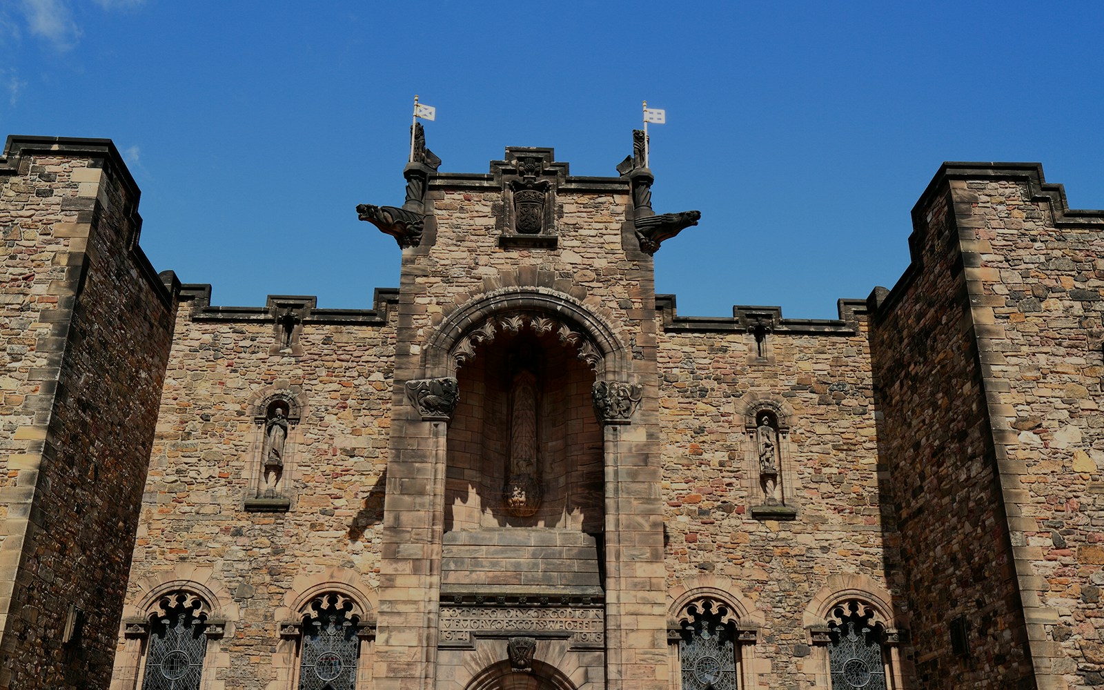 Edinburgh Castle Scottish National War Memorial stone facade with statues.