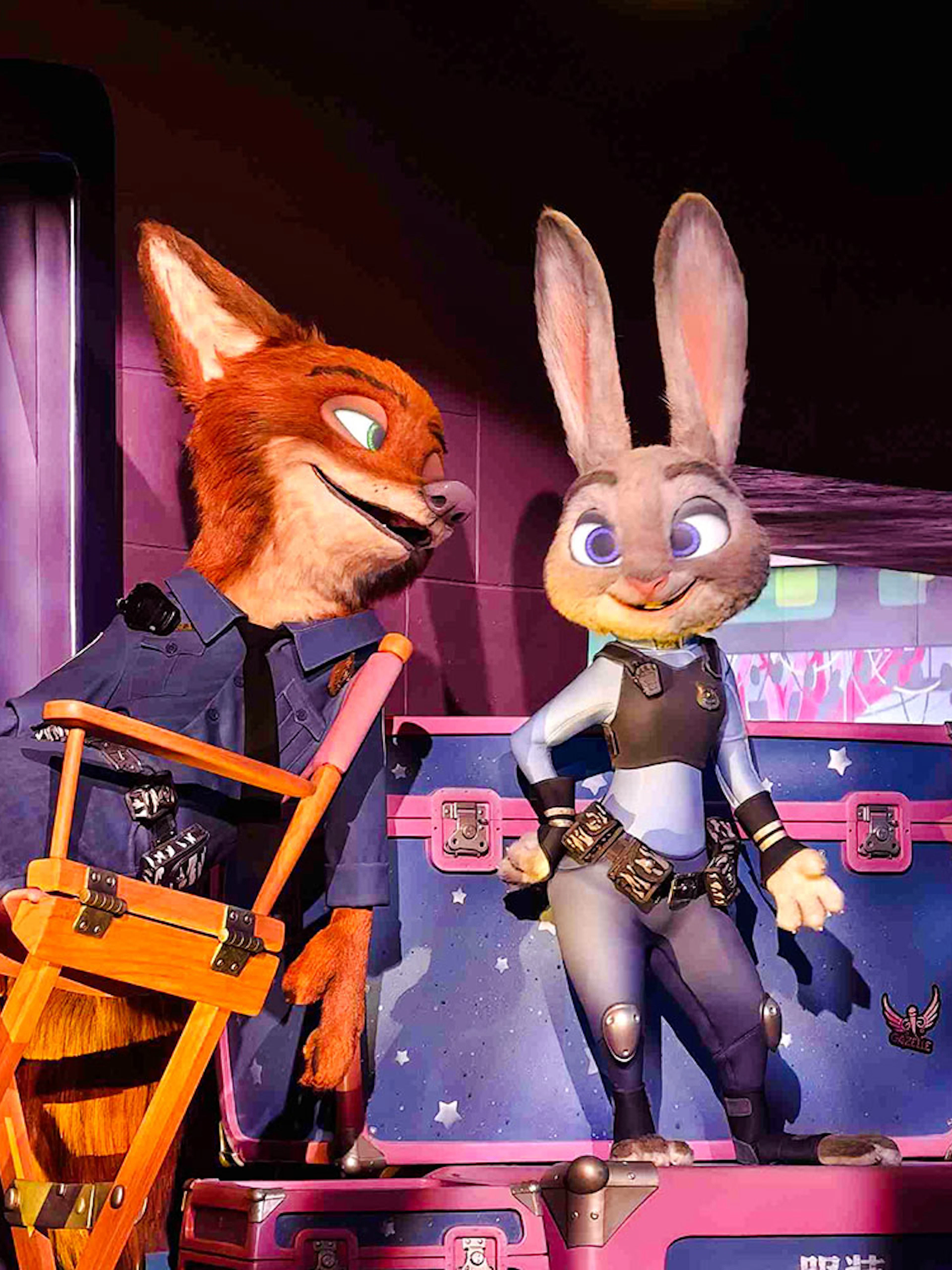 Animated characters in police uniforms at Zootopia: Hot Pursuit attraction.