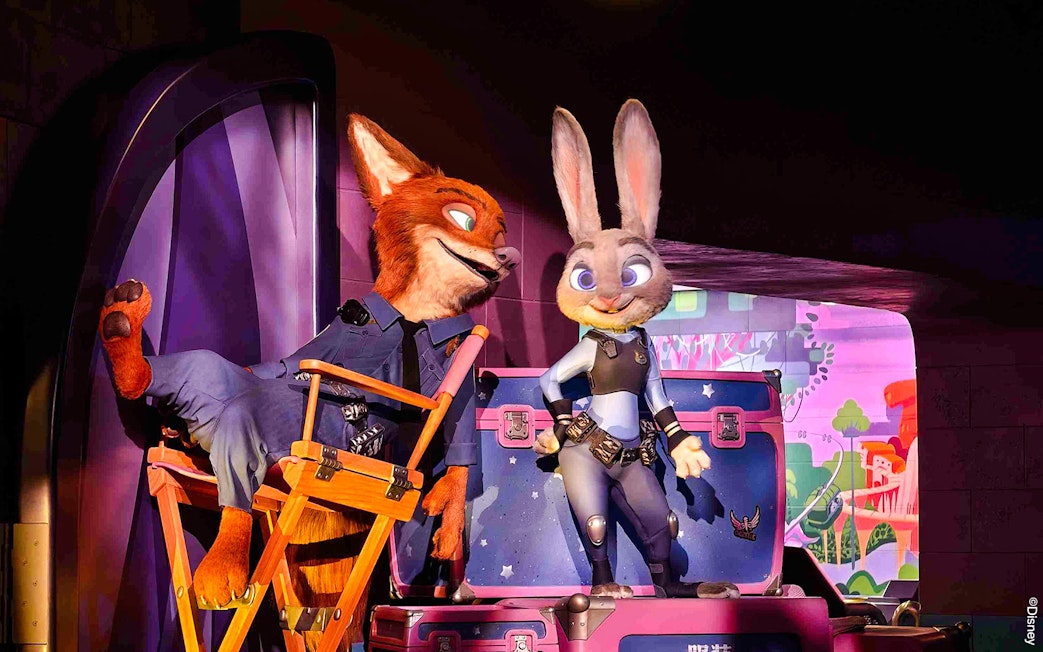 Animated characters in police uniforms at Zootopia: Hot Pursuit attraction.