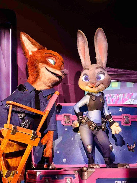Animated characters in police uniforms at Zootopia: Hot Pursuit attraction.