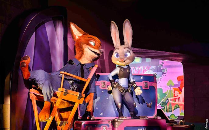 Animated characters in police uniforms at Zootopia: Hot Pursuit attraction.