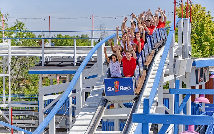 Visitors enjoying a roller coaster ride at Six Flags Great America.