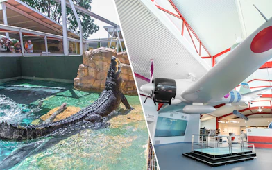 Crocodile in water at Crocosaurus Cove, Darwin, and a historic aircraft display indoors.