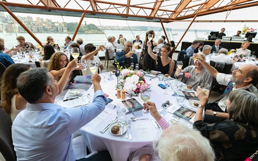 Guests toasting at a table during the NYE Opera Gala at Sydney Opera House.