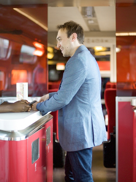 Euro Rail passengers at onboard cafe counter.