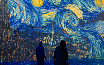 Visitors viewing Van Gogh's Starry Night at Dutch Masters Exhibition, Fabrique des Lumières.