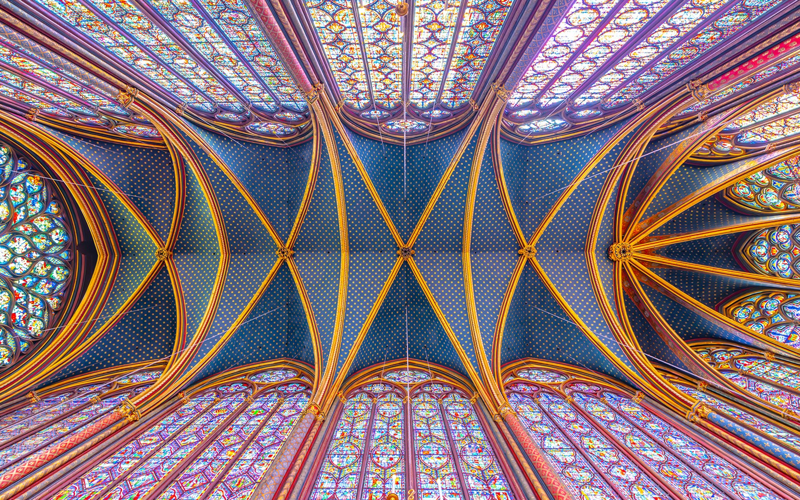 Monumental interior of Sainte-Chapelle with stained glass windows