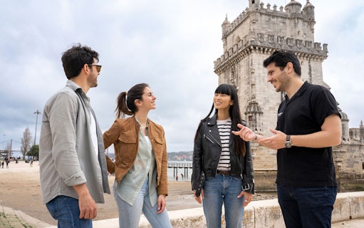 Tour group at Belém Tower, Lisbon, during a wine tour with 4WD vineyard experience.