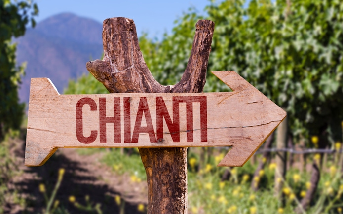 Chianti signpost in vineyard, Florence to Chianti wine region tour.