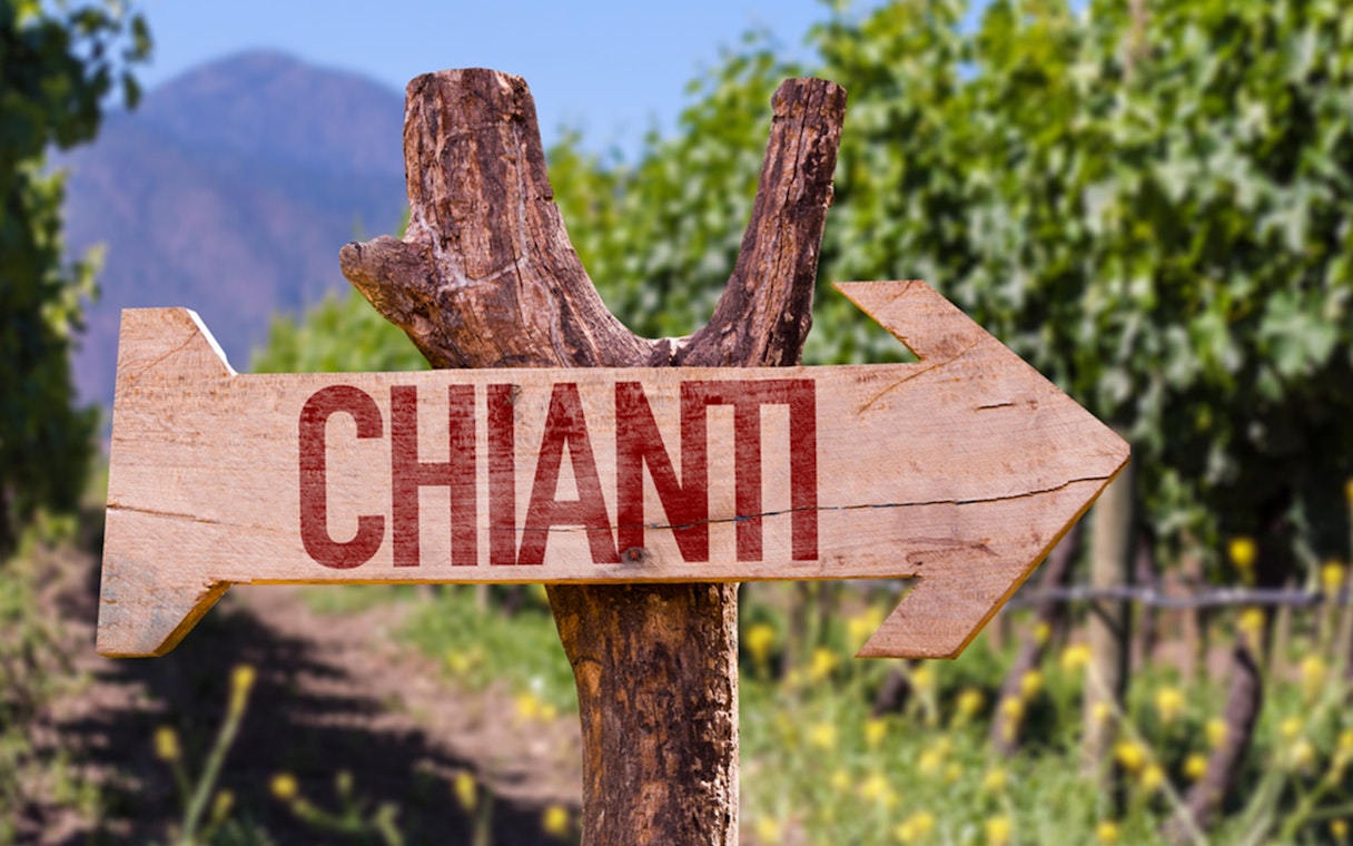 Chianti signpost in vineyard, Florence to Chianti wine region tour.