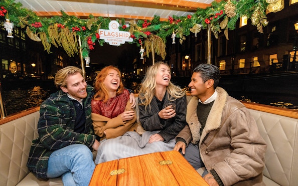 Guests enjoying the Luxury Heated Saloon Boat Evening Cruise in Amsterdam.