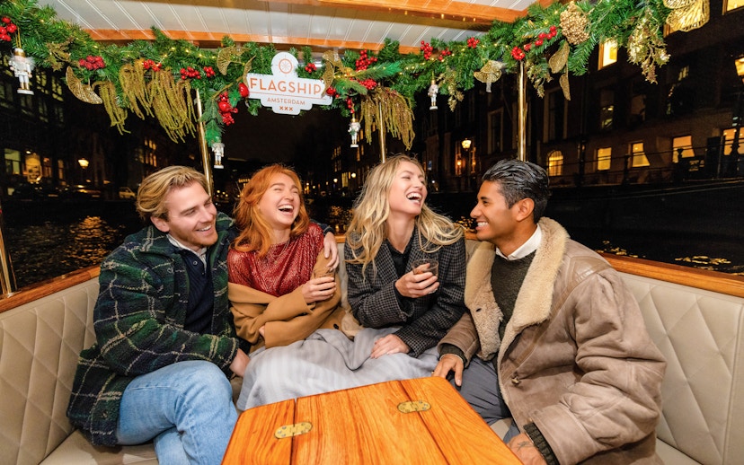 Guests enjoying the Luxury Heated Saloon Boat Evening Cruise in Amsterdam.