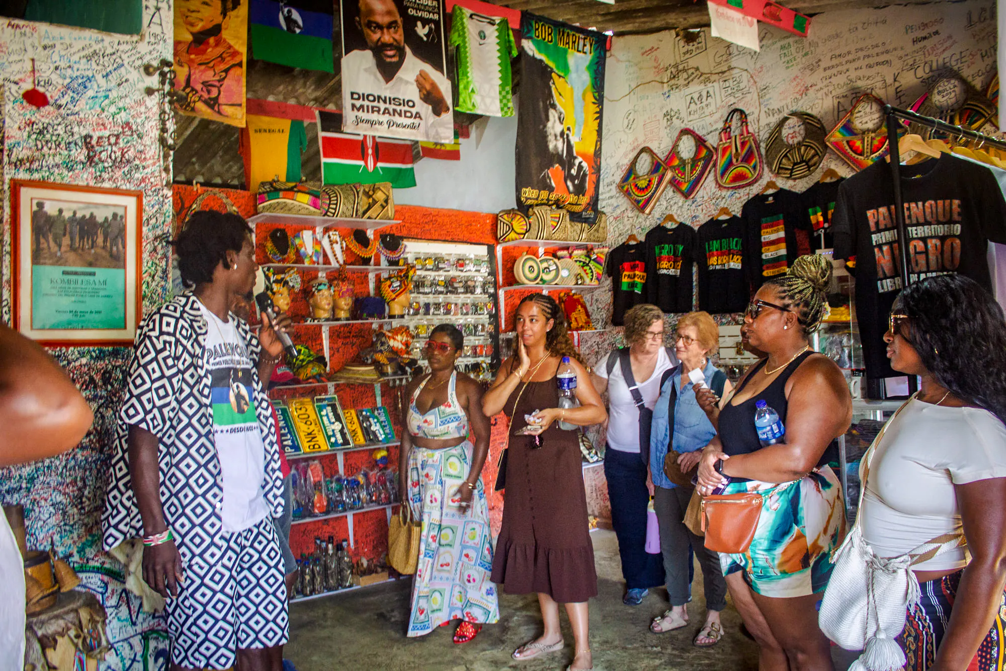 Tour group exploring a cultural shop in San Basilio de Palenque, Cartagena.