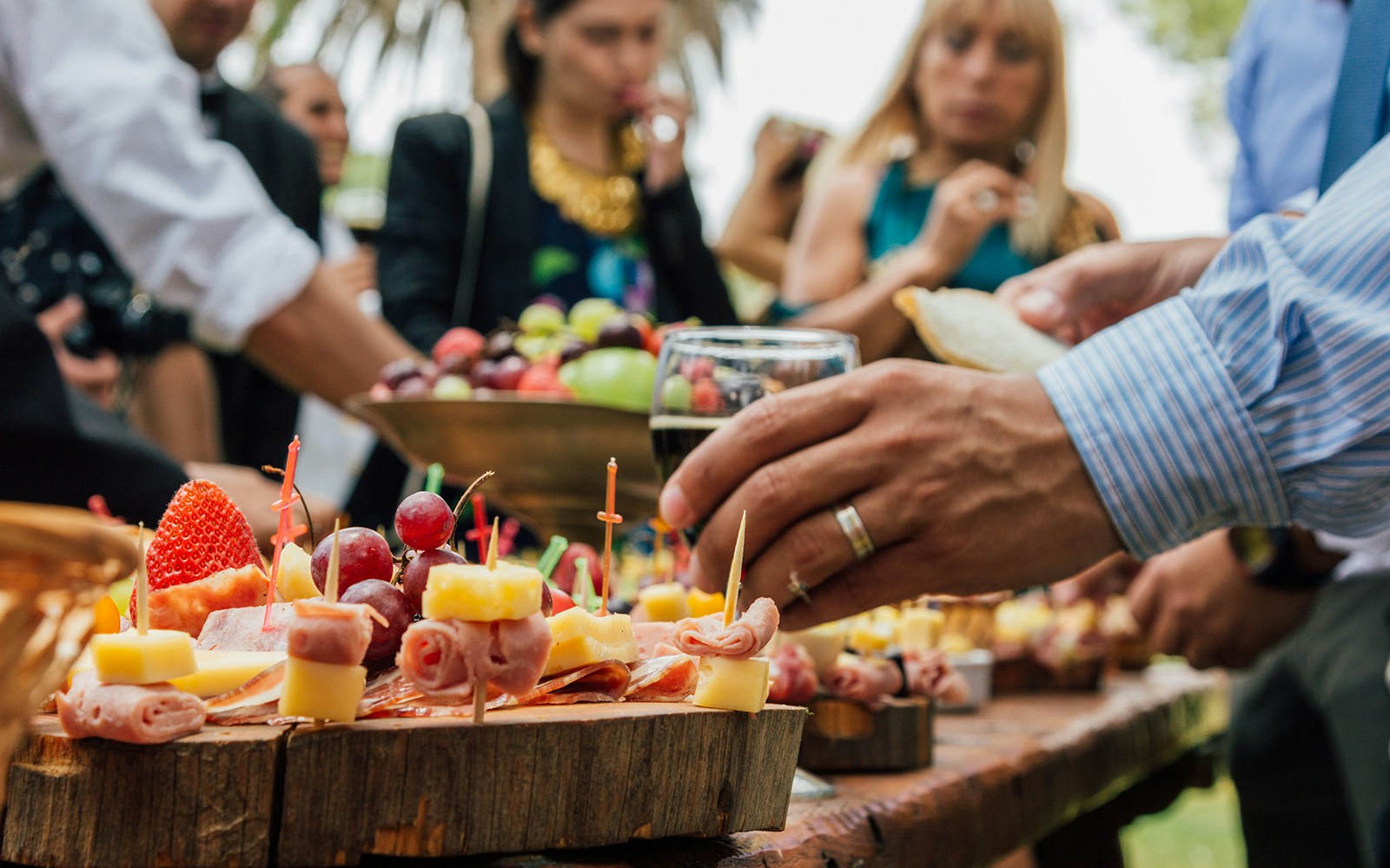 Bustling market at a Picada stall serving cheese and meat