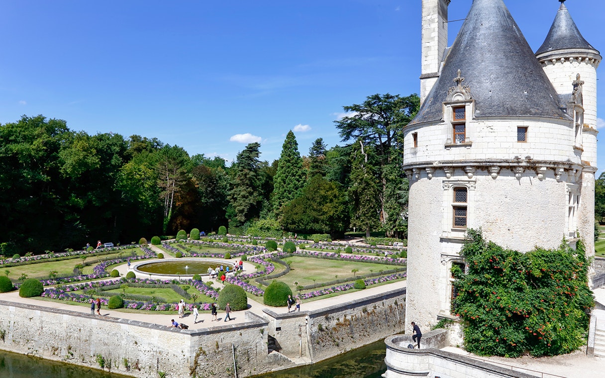 Chaumont-sur-Loire Castle exterior with gardens and visitors in France.
