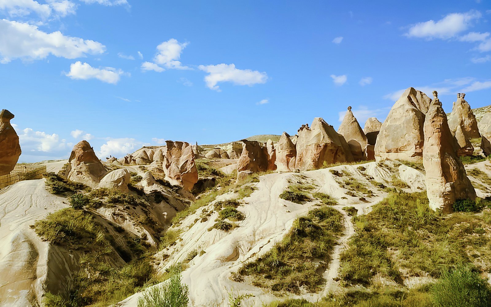 Devrent Valley rock formations under blue sky in Cappadocia, Turkey.