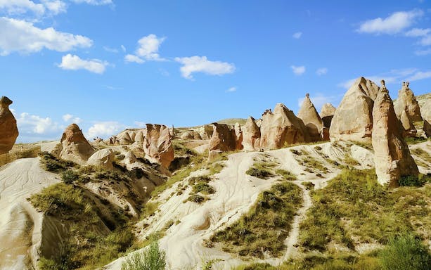 Devrent Valley rock formations under blue sky in Cappadocia, Turkey.