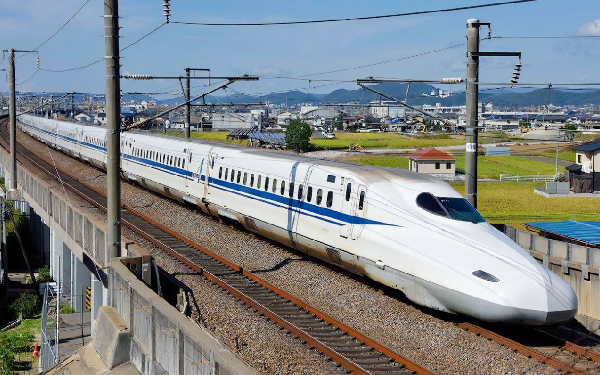 JR Kansai-Hiroshima train traveling through rural Japan.