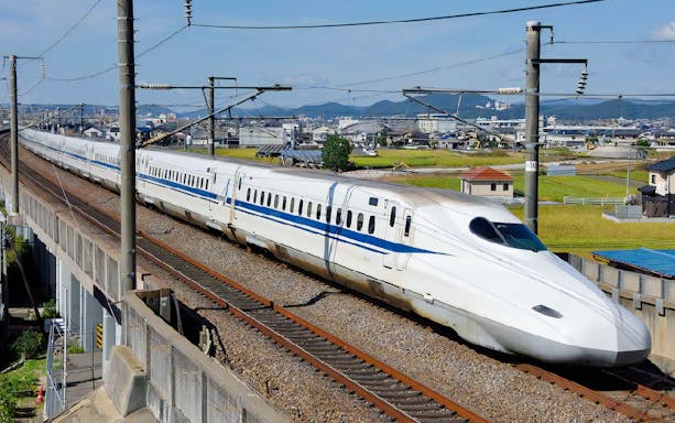 JR Kansai-Hiroshima train traveling through rural Japan.