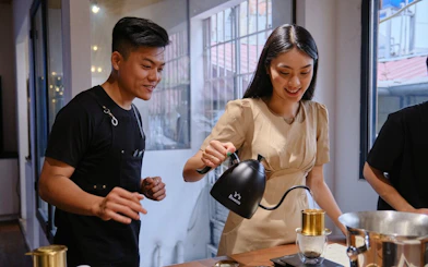 Participants learning to brew coffee at a workshop in Hồ Chí Minh City.