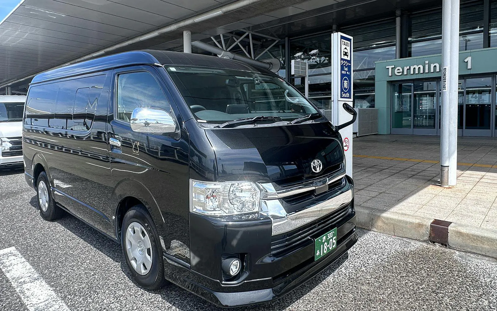 Van parked at Kansai Airport Terminal 1 for Osaka City private transfer.