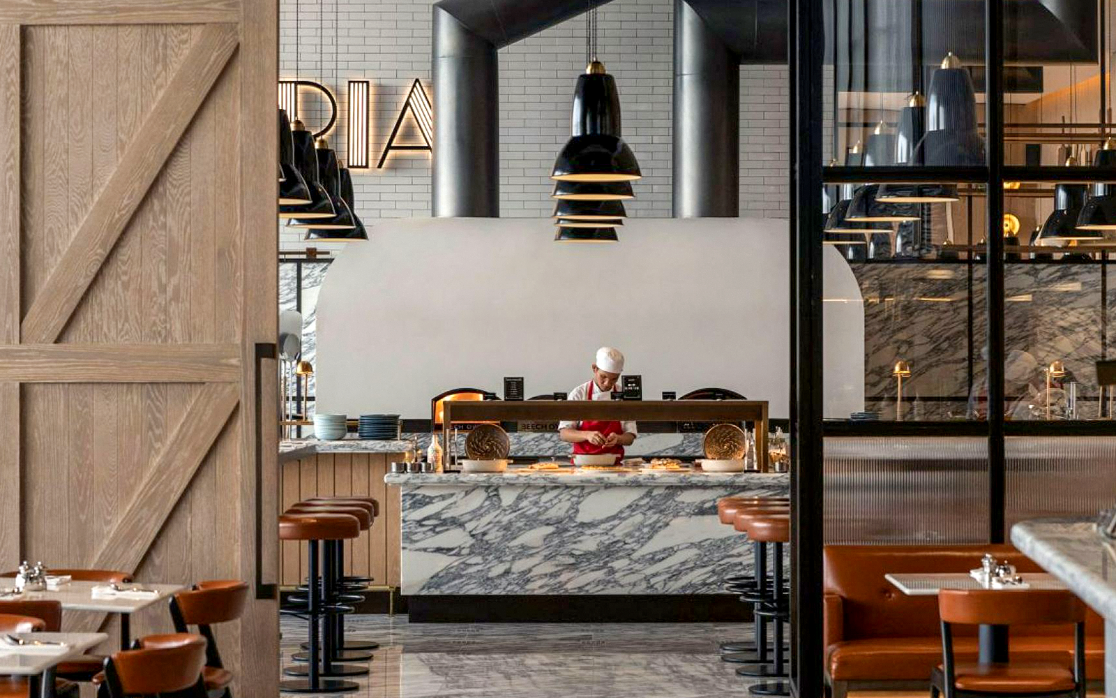 Chef preparing dishes at live cooking station, Gastronomy Buffet Dinner, Dubai.