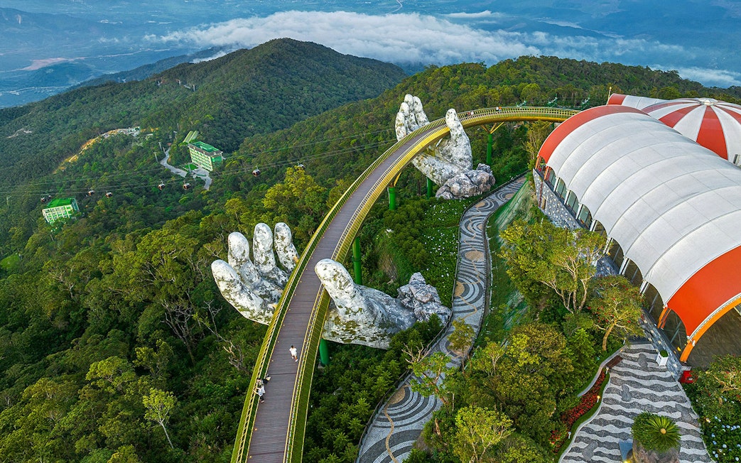 Aerial view of Golden Bridge held by giant hands at Sun World Ba Na Hills, Da Nang, Vietnam.