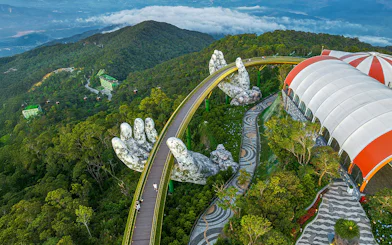 Aerial view of Golden Bridge held by giant hands at Sun World Ba Na Hills, Da Nang, Vietnam.