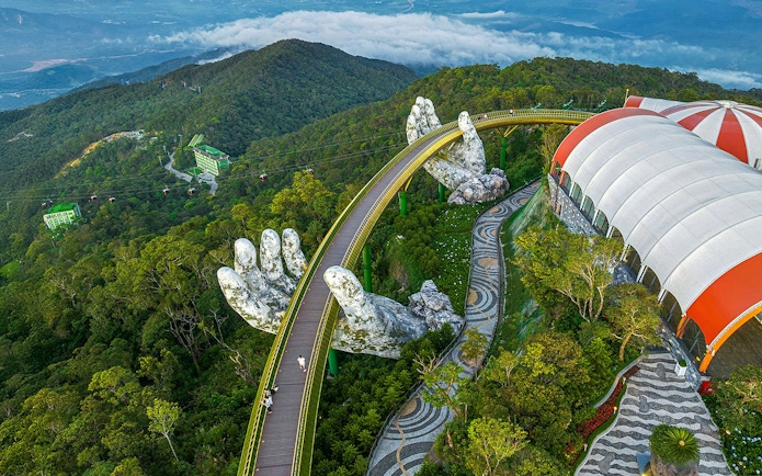 Aerial view of Golden Bridge held by giant hands at Sun World Ba Na Hills, Da Nang, Vietnam.