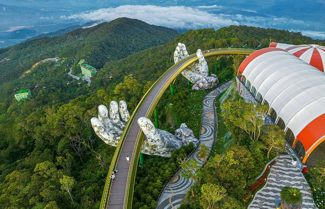Aerial view of Golden Bridge with giant hands at Sun World Ba Na Hills, Da Nang, Vietnam.
