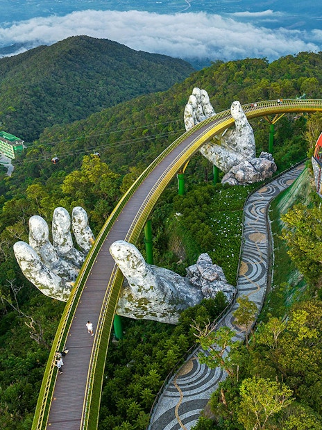 Aerial view of Golden Bridge held by giant hands at Sun World Ba Na Hills, Da Nang, Vietnam.