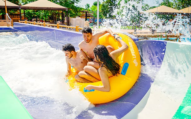 Group enjoying Waikiki Jungle water slide at Aquopolis.