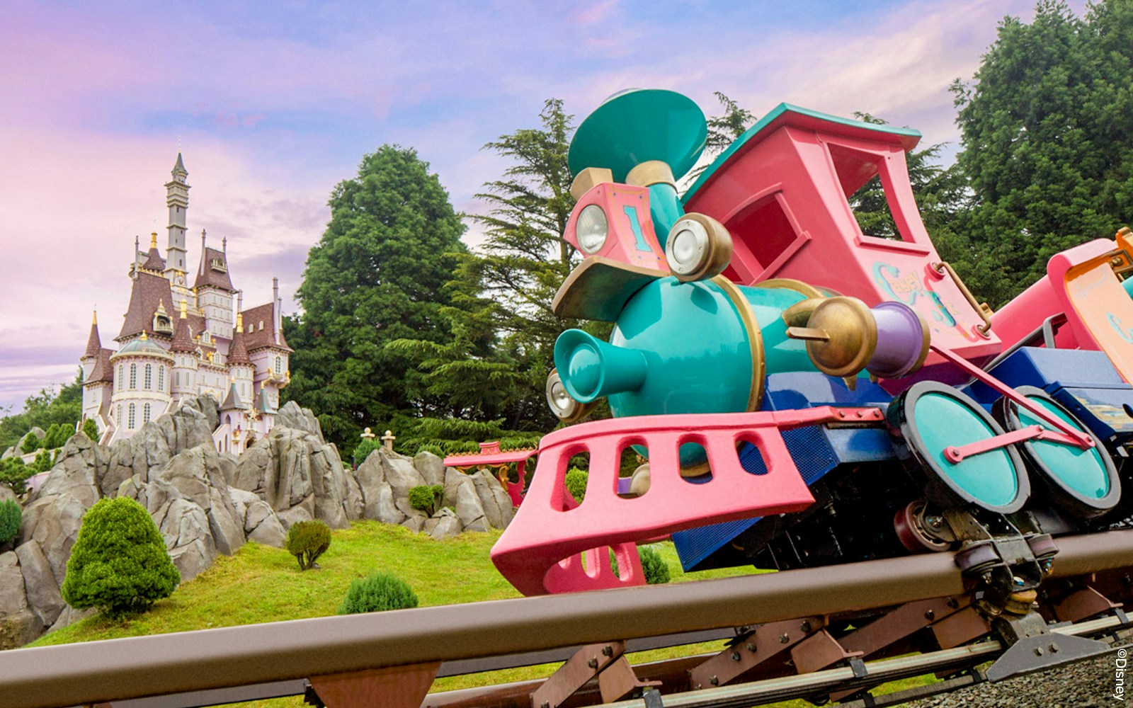 Casey Jr. train ride at Disneyland Paris with colorful circus-themed carriages.