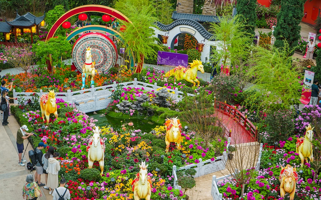 Spring blossoms and horse sculptures at Flower Dome, Gardens by the Bay, Singapore.