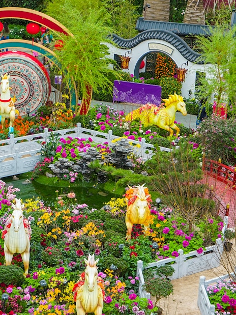 Spring blossoms and horse sculptures at Flower Dome, Gardens by the Bay, Singapore.